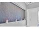 Bright hallway with elegant details and a decorative wall feature, leading to the front door at 11325 Juglans Dr, Odessa, FL 33556