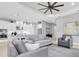 Bright living room with an open layout, connecting the kitchen and living area for easy interaction at 11325 Juglans Dr, Odessa, FL 33556