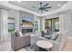 Spacious living room with a modern fireplace, TV, and comfortable seating, creating a relaxing atmosphere at 11325 Juglans Dr, Odessa, FL 33556