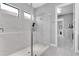 Glass shower with floor-to-ceiling marble and niche at 11325 Juglans Dr, Odessa, FL 33556