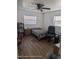 This bedroom features a ceiling fan and wood-look flooring at 12116 Lamont Dr, Spring Hill, FL 34608
