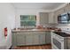 Kitchen with stainless steel appliances, wood countertops and a large window at 12116 Lamont Dr, Spring Hill, FL 34608