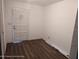 Bright room featuring new wood-look flooring and a freshly painted interior at 12116 Lamont Dr, Spring Hill, FL 34608
