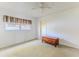 Bright bedroom featuring a ceiling fan, a window, and a wooden cedar chest at 12191 Monarco Ln, Spring Hill, FL 34609