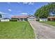 Charming single-story home with well-maintained landscaping and a two-car garage at 12191 Monarco Ln, Spring Hill, FL 34609