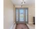 Welcoming foyer with tiled floors and decorative glass front door at 12191 Monarco Ln, Spring Hill, FL 34609