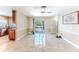 Bright living room featuring a sliding glass door and tile flooring that leads to outdoor space at 12191 Monarco Ln, Spring Hill, FL 34609