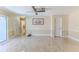 The spacious living room has neutral paint, decorative trim, and smooth tile flooring at 12191 Monarco Ln, Spring Hill, FL 34609