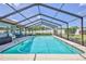 Inviting screened-in pool area with ample space for relaxation and entertainment at 12191 Monarco Ln, Spring Hill, FL 34609