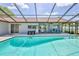 Relaxing pool and patio area are perfect for outdoor gatherings at 12191 Monarco Ln, Spring Hill, FL 34609