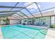 Relaxing pool and patio area are perfect for outdoor gatherings at 12191 Monarco Ln, Spring Hill, FL 34609