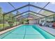 Beautiful screened-in pool is perfect for outdoor fun at 12191 Monarco Ln, Spring Hill, FL 34609
