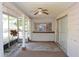 The home has a covered back porch with a ceiling fan at 12210 Quail Run Row, Hudson, FL 34667