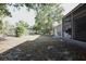 The property features a large backyard with a covered back porch at 12210 Quail Run Row, Hudson, FL 34667