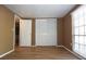 A bedroom featuring wood-look flooring, a window, and a closet with sliding doors at 12210 Quail Run Row, Hudson, FL 34667