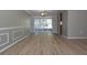 Open dining room with light-colored walls, white trim, and laminate flooring leading to the patio at 12210 Quail Run Row, Hudson, FL 34667