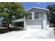 Two story home with an attached two car garage and mature trees at 12210 Quail Run Row, Hudson, FL 34667