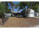 Charming single-story home with mature trees, a two-car garage, and a well-maintained front yard at 12210 Quail Run Row, Hudson, FL 34667