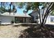 Charming single-Gathering home with a well-maintained lawn and a large tree in the front yard at 12210 Quail Run Row, Hudson, FL 34667