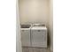 Laundry room with tile floors and Maytag washer and dryer at 12630 Aston Dr, Hudson, FL 34669