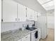 Kitchen with granite countertops and white appliances at 12709 Cedar Ridge Dr, Hudson, FL 34669