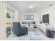 Modern living room with neutral furniture, stylish decor, and sliding glass doors for ample natural light at 12709 Cedar Ridge Dr, Hudson, FL 34669