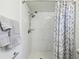 Shower with marble tile and two shower heads at 12709 Cedar Ridge Dr, Hudson, FL 34669