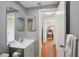 Practical bathroom featuring a vanity sink, mirror, and convenient towel rack at 12906 Sandburst Ln, Hudson, FL 34667