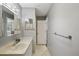Well-lit bathroom with a single vanity, neutral color scheme, and a clean, functional design at 12906 Sandburst Ln, Hudson, FL 34667