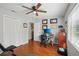 Bedroom featuring natural light, closet, and hardwood floors perfect for a home office at 12906 Sandburst Ln, Hudson, FL 34667