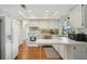Bright kitchen with white cabinets, a garden window, and a functional layout perfect for cooking and entertaining at 12906 Sandburst Ln, Hudson, FL 34667