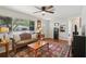 Bright and inviting living room with hardwood floors and lots of natural light at 12906 Sandburst Ln, Hudson, FL 34667
