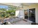 Enjoy this inviting screened-in patio with a view of the beautiful backyard landscaping at 12906 Sandburst Ln, Hudson, FL 34667