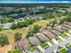 An aerial view of a neighborhood with mature trees and green space at 13111 Precept Way, Hudson, FL 34669