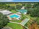 Aerial view of the community pool and shuffleboard courts at 13111 Precept Way, Hudson, FL 34669