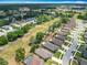 Picturesque aerial view of a peaceful neighborhood featuring well-maintained homes, lush greenery, and open spaces at 13111 Precept Way, Hudson, FL 34669