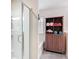 Stylish bathroom with a glass shower, soaker tub and linen closet at 13111 Precept Way, Hudson, FL 34669