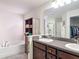 Bathroom featuring double sink vanity, soaking tub, and a walk-in shower at 13111 Precept Way, Hudson, FL 34669