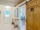 Inviting entryway featuring decorative tile floors, sliding barn door and a charming table at 13111 Precept Way, Hudson, FL 34669