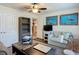 Comfortable office space featuring hardwood floors, neutral colors, turtle art, and functional furnishings at 13111 Precept Way, Hudson, FL 34669