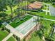 Overhead shot of community shuffleboard court, manicured landscaping, benches, and a fire pit at 13111 Precept Way, Hudson, FL 34669