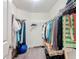 Spacious walk-in closet features ample storage and organization with shelves and hanging rods for all your clothing and accessories at 13111 Precept Way, Hudson, FL 34669