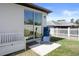 Relaxing back patio with sliding glass doors and a privacy fence at 13205 Arkendale St, Spring Hill, FL 34609