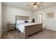Bright bedroom featuring modern decor, ceiling fan and comfortable bed with decorative pillows at 13205 Arkendale St, Spring Hill, FL 34609