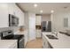 Modern kitchen with stainless steel appliances, quartz countertops, and ample cabinet space at 13205 Arkendale St, Spring Hill, FL 34609