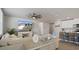 Open concept living room that flows into the dining area and kitchen, perfect for entertaining at 13205 Arkendale St, Spring Hill, FL 34609