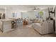 Open-concept living room with a dining area, comfortable seating, and natural light at 13205 Arkendale St, Spring Hill, FL 34609