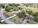 An aerial view of a residential area shows a cluster of homes, some with screened in pools at 13373 Lawrence St, Spring Hill, FL 34609