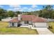 Aerial shot showcasing the home, landscaping, and surrounding neighborhood at 13373 Lawrence St, Spring Hill, FL 34609
