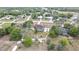 Overhead view displays a well-kept home with a fenced yard, inviting screened pool, and a lush, green outdoor space at 13373 Lawrence St, Spring Hill, FL 34609